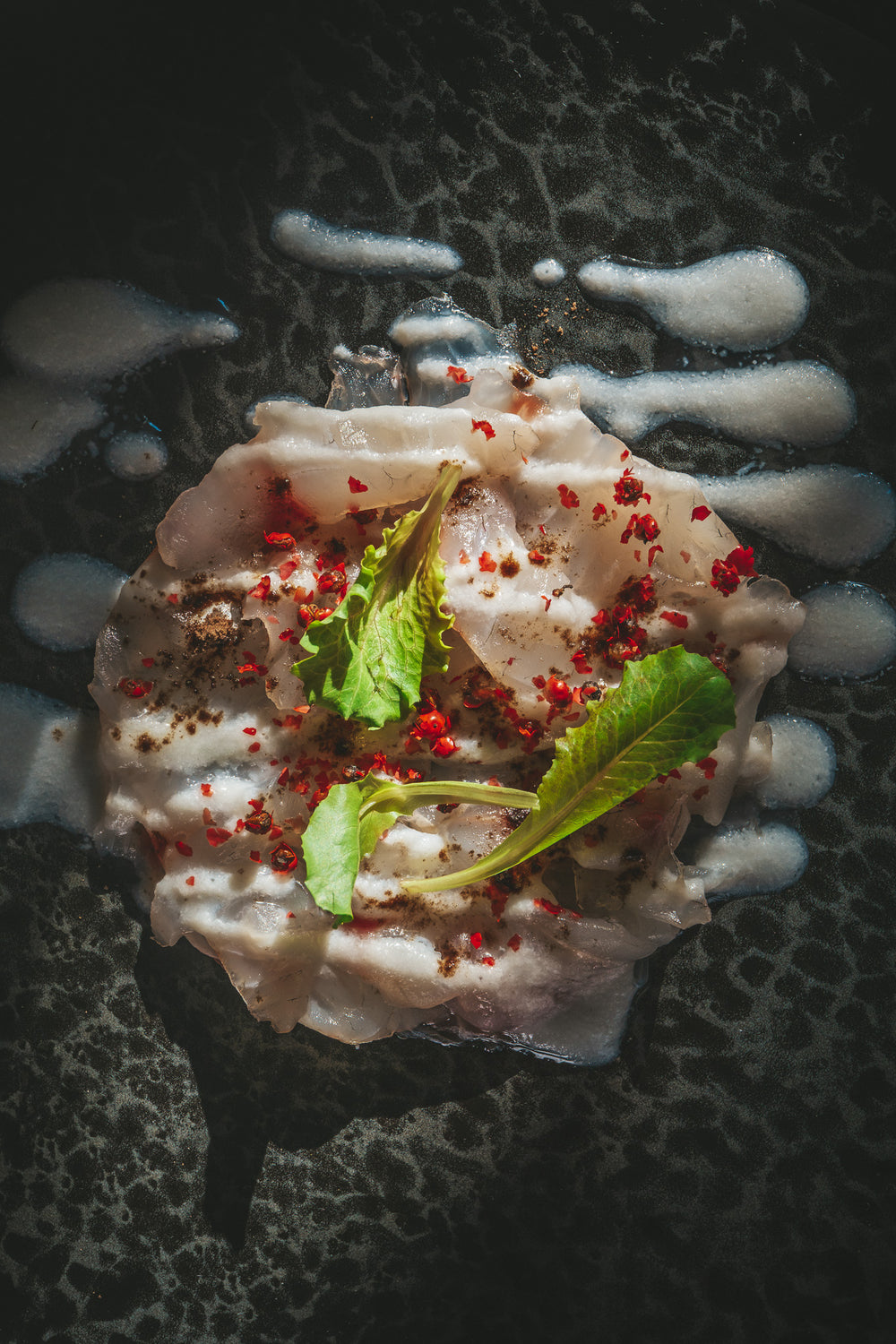 Sea Bass Carpaccio with Buffalo Cream, Pink Pepper, and Truffle Zest®
