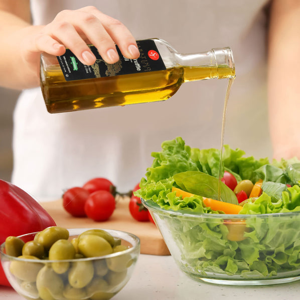 Black Truffle Infused Olive Oil - pouring on salad